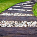 16353195-walkway-made-a-a-of-wood-and-stone-on-the-grass